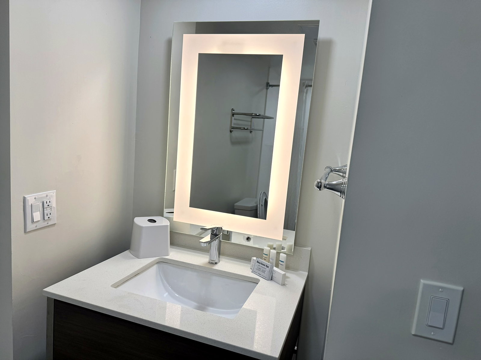 Lit-mirror sink vanity